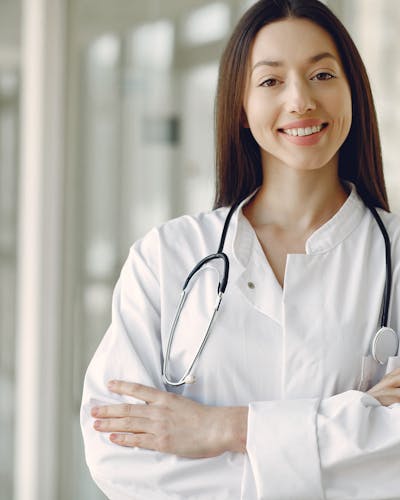 Portrait of an orthodontist wearing clinical attire